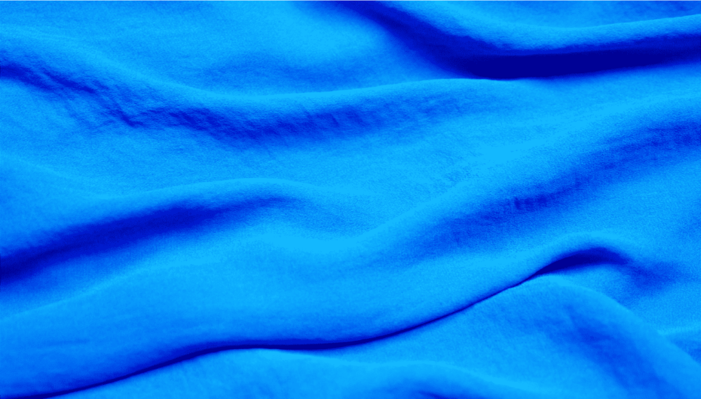 The image shows a blue crepe fabric in detail.