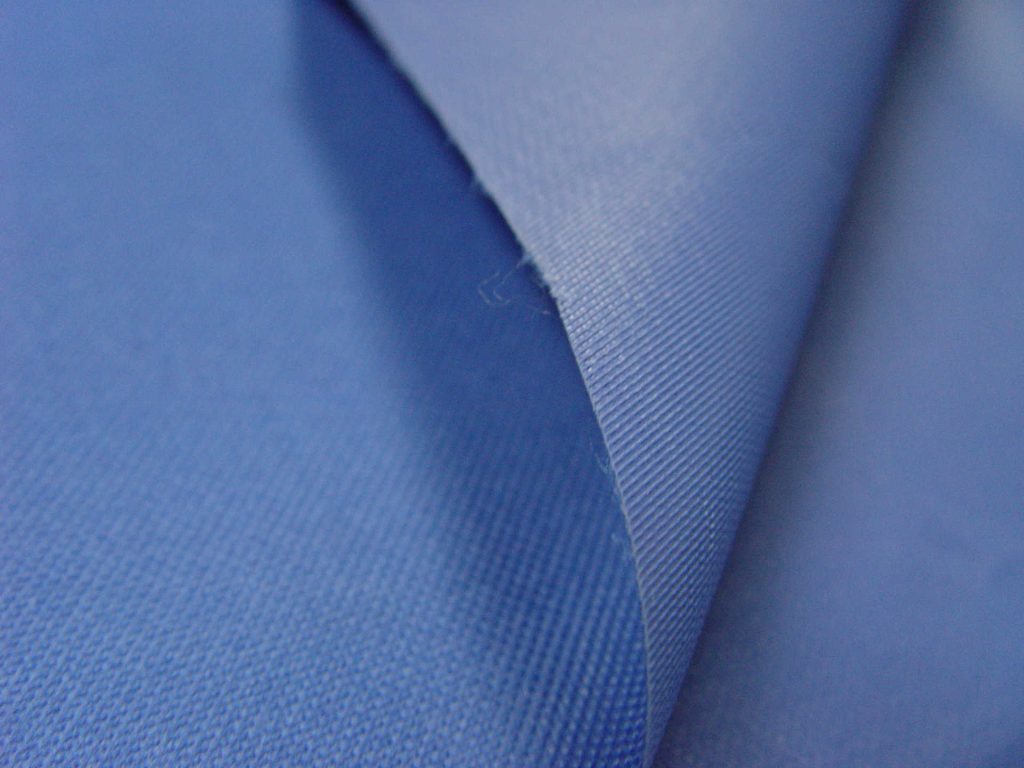 A sample of light blue Oxford fabric in detail.