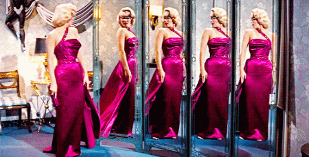 Marilyn Monroe wears a stunning satin dress