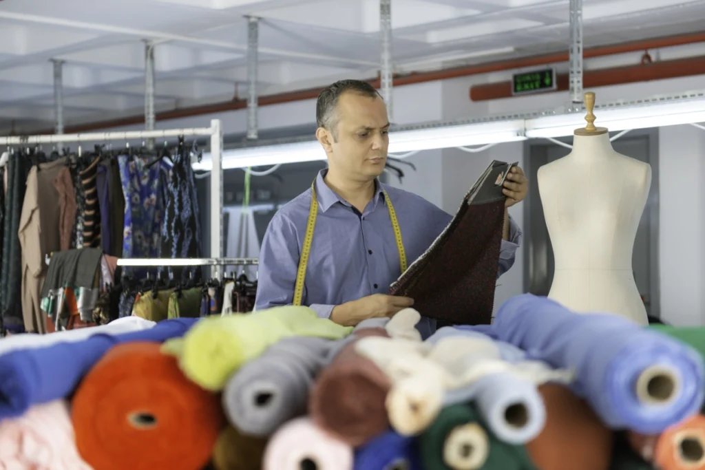 A production manager working in an apparel manufacturing.