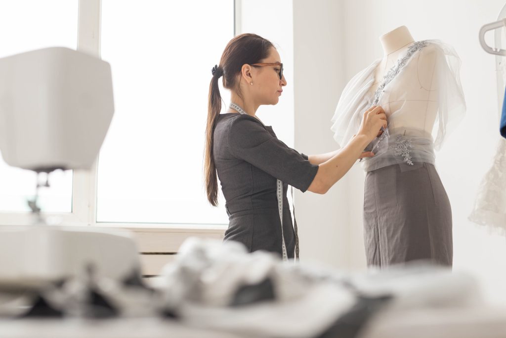 Professional working in a fashion studio in a company that adopts Industry 5.0 concepts.