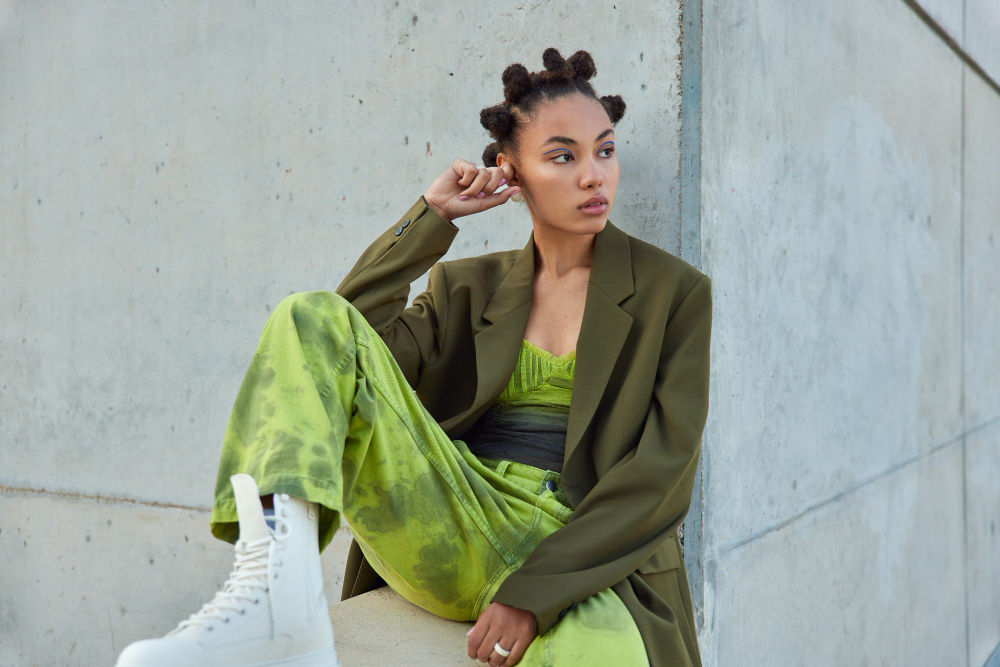 Fashion collection: presentation of a green outfit look.