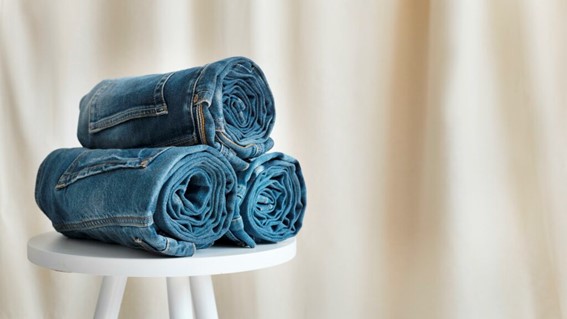 Image shows three pairs of customized jeans, representing the importance of sustainable consumption and production.