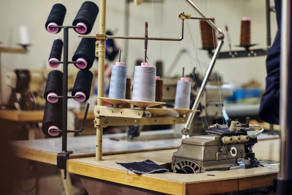 Image of a lot of coils with a threads at the sewing workshop.