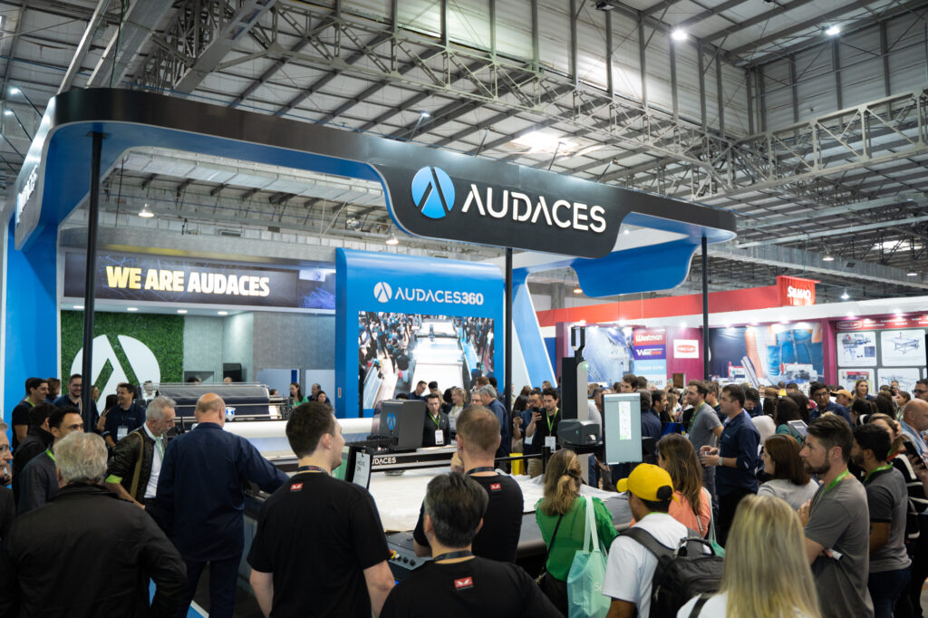 The image shows the Audaces booth at a textile fair
