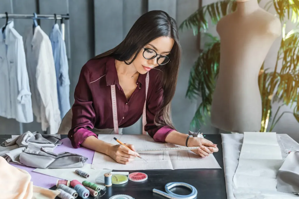 Woman in a fashion bureau while doing fashion trend research