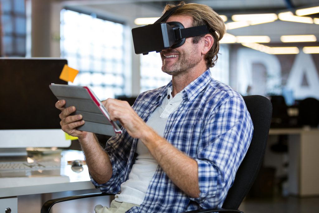 A man visualizing a piece of menswear with the help of an Augmented Reality device. 