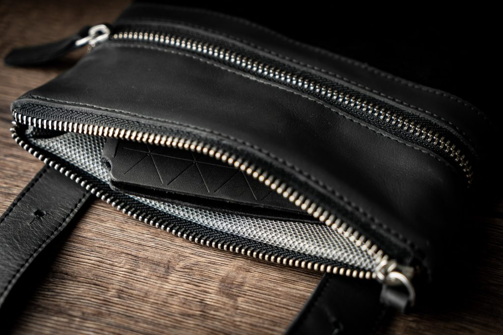 A fashionable purse showcasing the application of bonded fabric for enhanced durability and elegance.