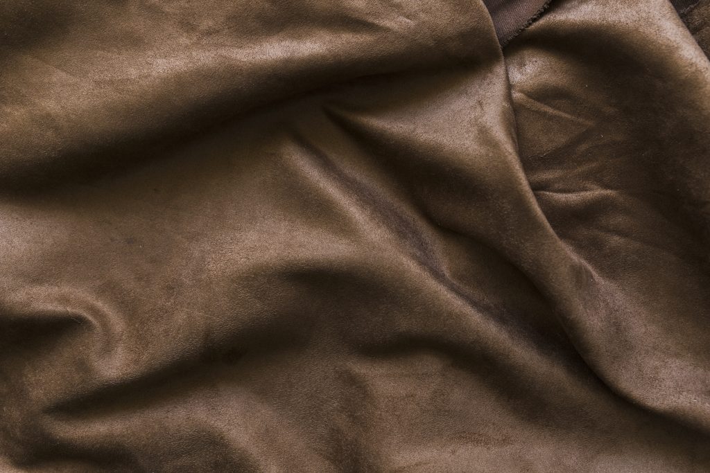 Fabric composition: A velvet swatch in brown color. 