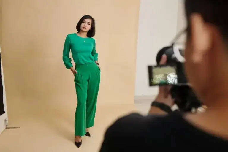 Women's fashion online: Model posing for e-commerce lookbook in photo studio.  