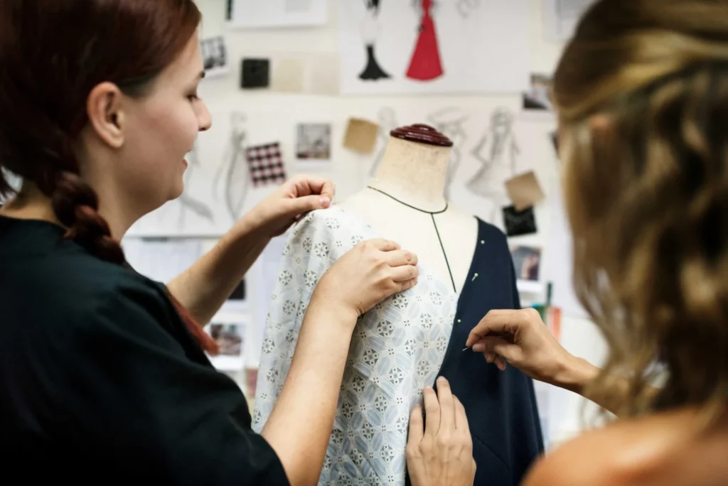 Women creating garments with ready-made garment patterns 