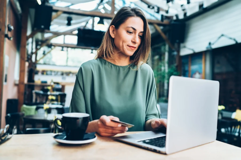 A woman using e-commerce technology to buy dressing trends online.