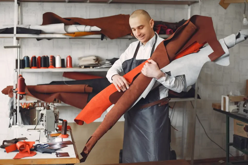 A man working in fashion manufacturing with sustainable design.