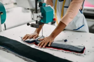 A female worker experiencing slow cutting in a garment manufacturing.