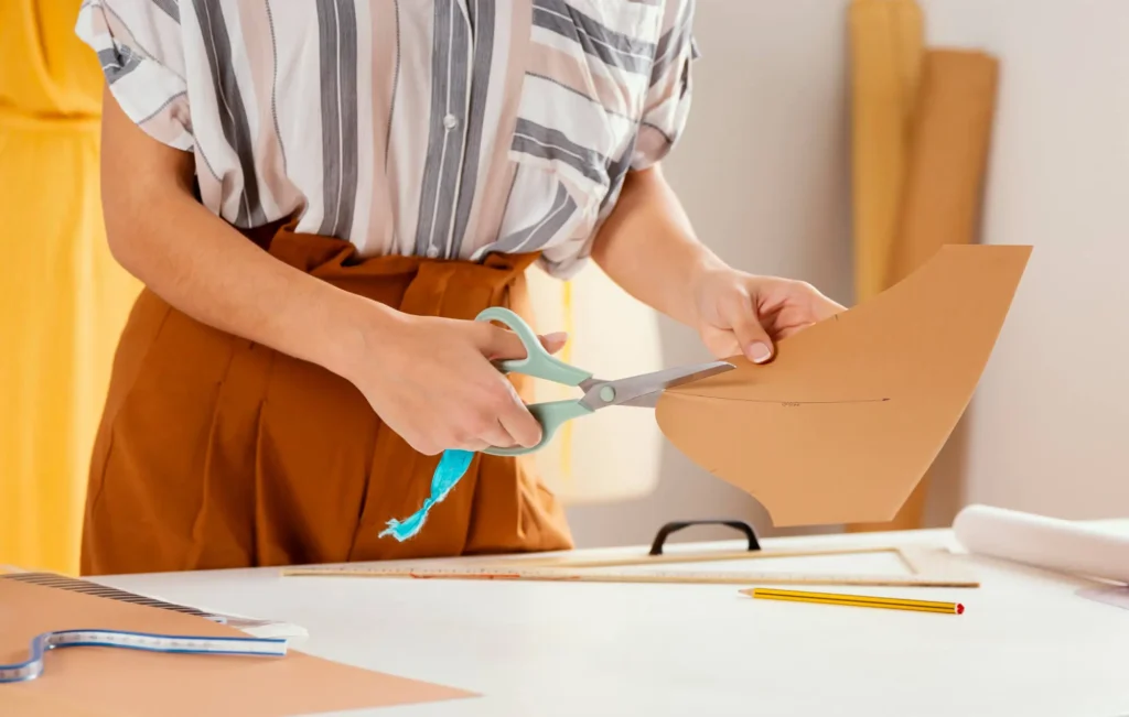 A fashion designer creating clothing pattern design.