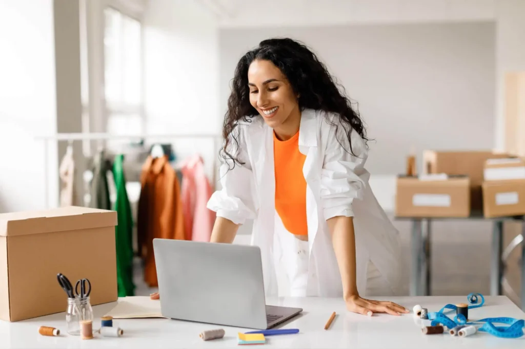 A woman selling designer clothes on her own online store.