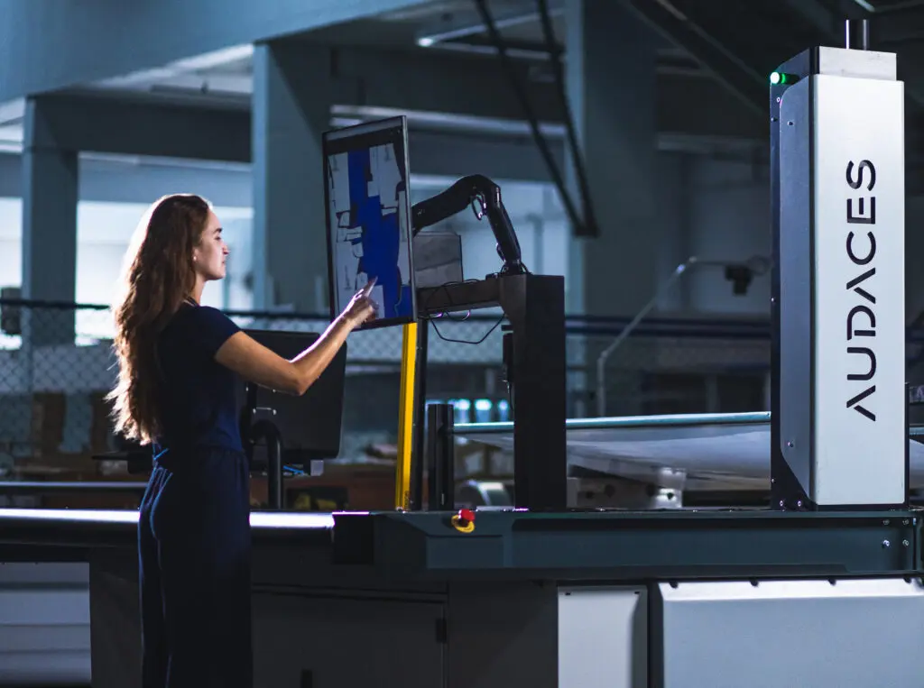  Audaces fabric cutting machine being operated by an industry professional 