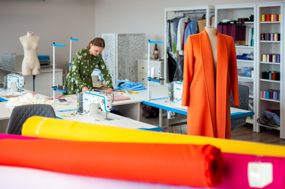 A woman working in clothing manufacturing, exploring her production capacity.