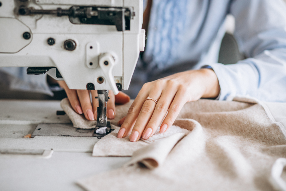 A seamstress using a straight stitch, one of the most common types of sewing.