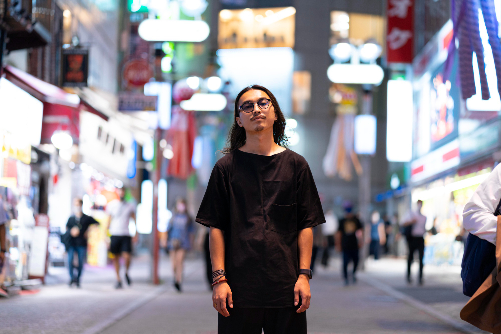 Japan fashion: a young Japanese man in an urban setting.