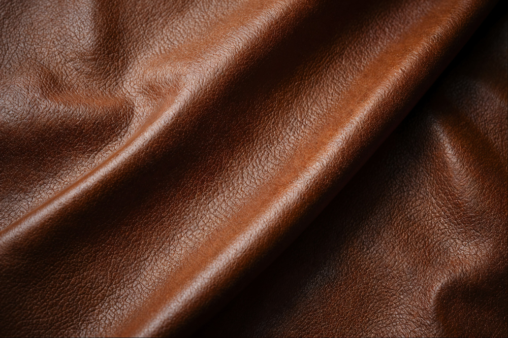 Texture design: a piece brown fabric with a leather texture.