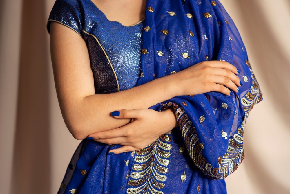 Types of sarees: a classic Indian dress, blue with gold embellishments.
