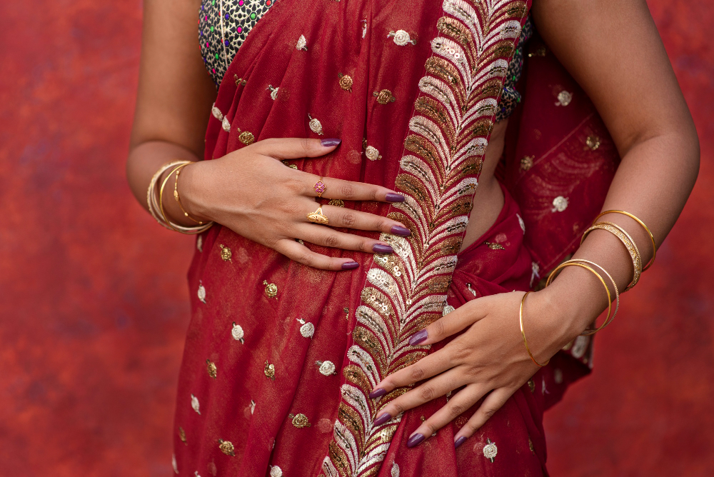 Types of sarees: a typical Indian garment in red with gold details.
