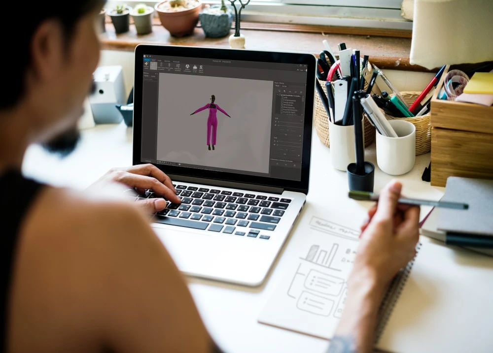 Estilista utilizando o Audaces Fashion Studio para criar desenhos 3D