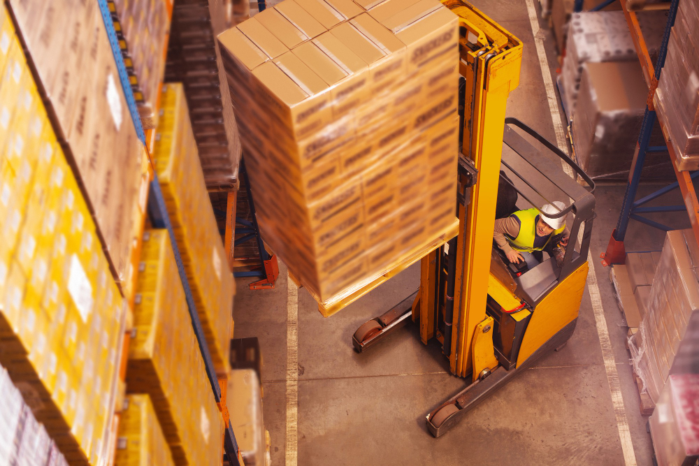 Material handling: a man in the industry operating a forklift.