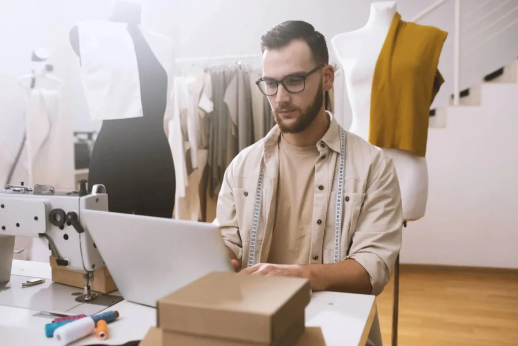 Production and productivity: a fashion industry professional working at a computer.