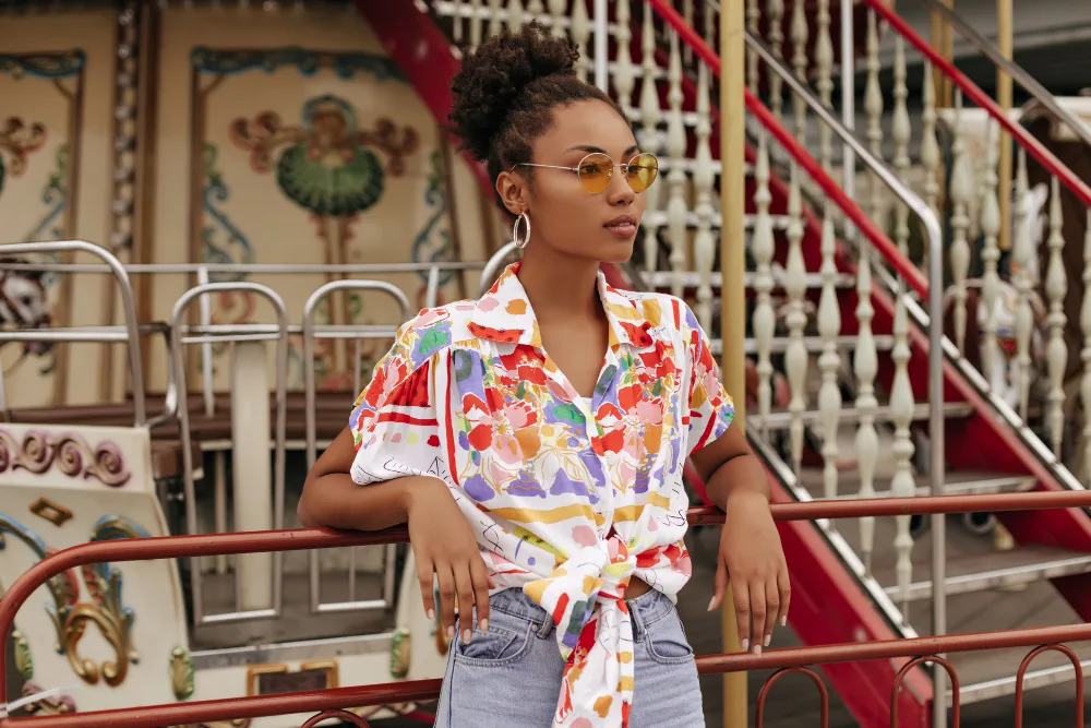 Surface design: a woman wearing a colorful patterned shirt.