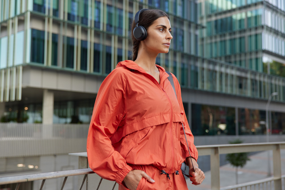 Activewear: a woman wearing orange sportswear.