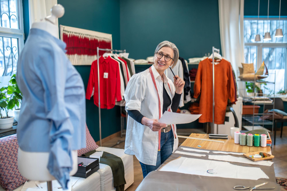 Clothing size chart: A fashion professional in her working environment.