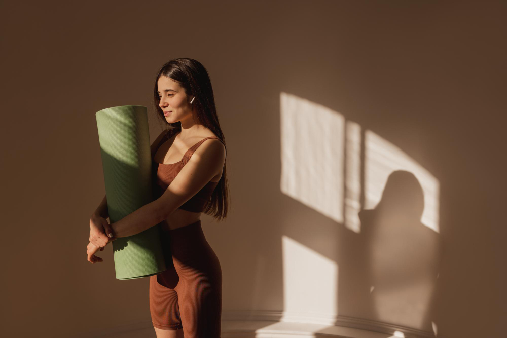 Seamless: a woman wearing brown yoga clothes.