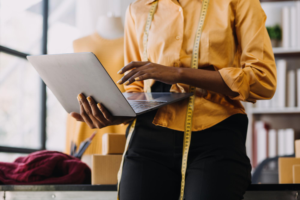 Types of automation: a fashion professional using technology on a tablet.
