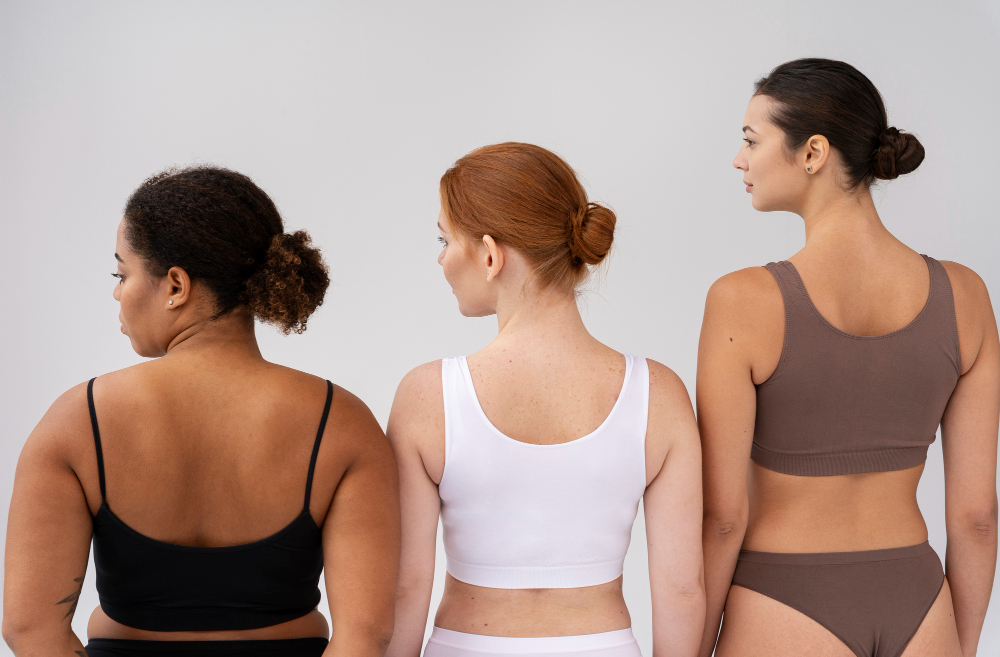 Types of body shapes: three women with different body types posing together.