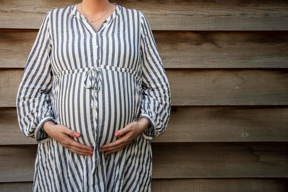 Market niche: A pregnant woman wearing maternity wear.