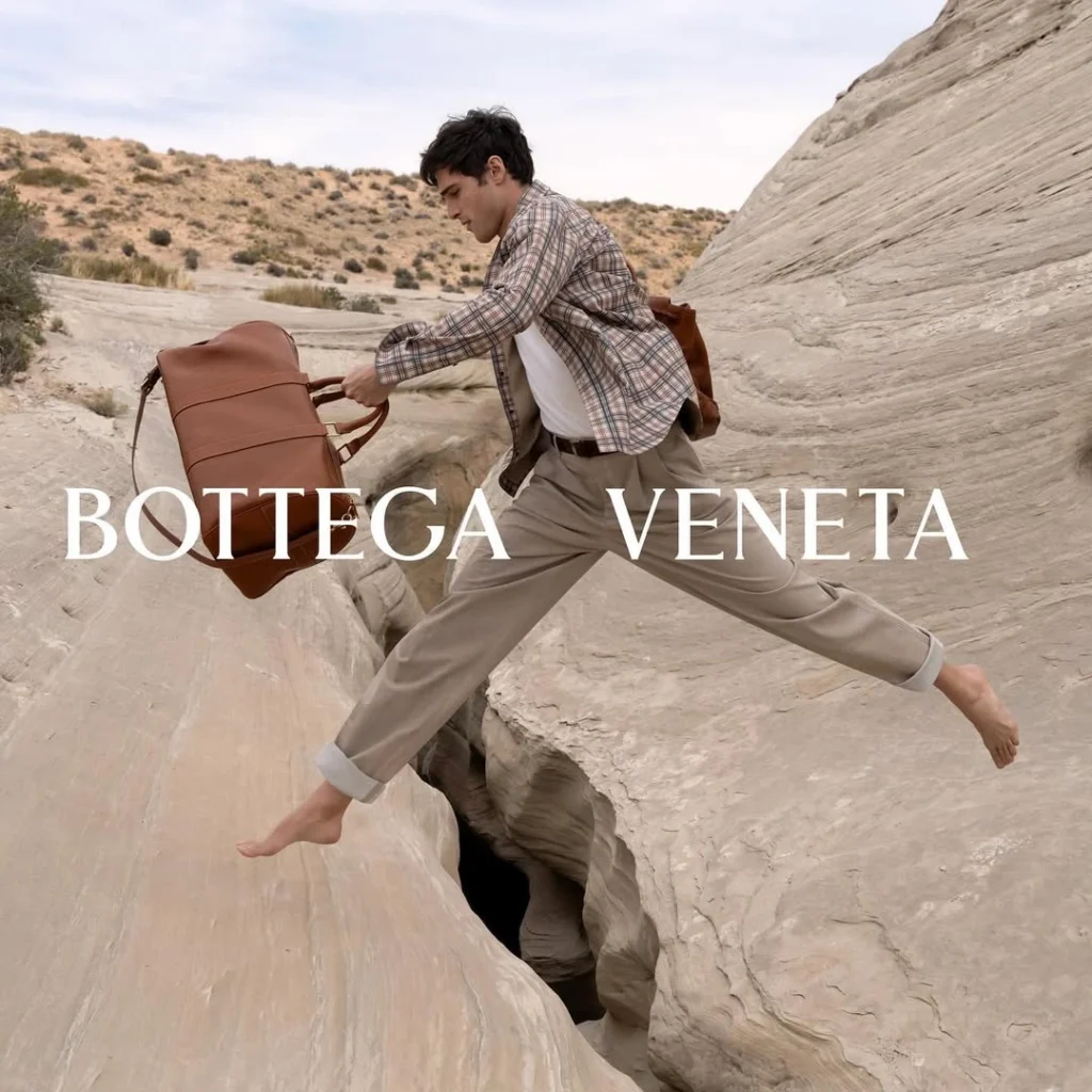 A model jumping in a Bottega Veneta campaign from the period when Matthieu Blazy was leading the brand.