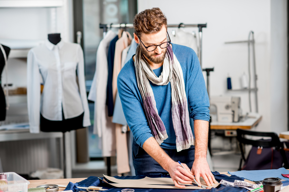 Garment manufacturing: a fashion professional working on design creation.