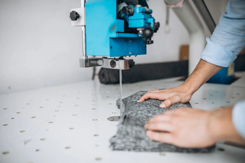 Productive efficiency: a professional operating a cutting machine.